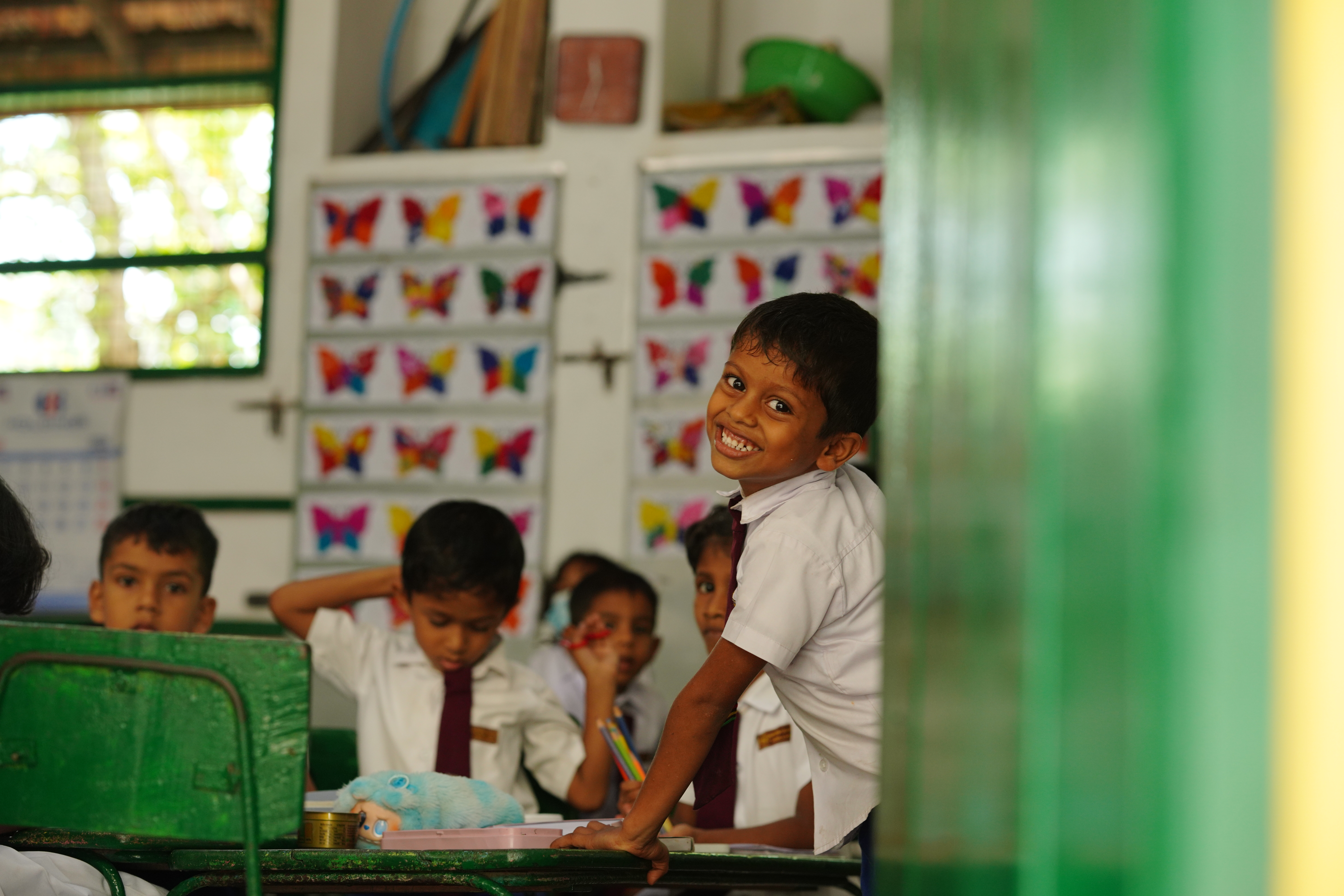 Volunteers conducting interactive classroom activities